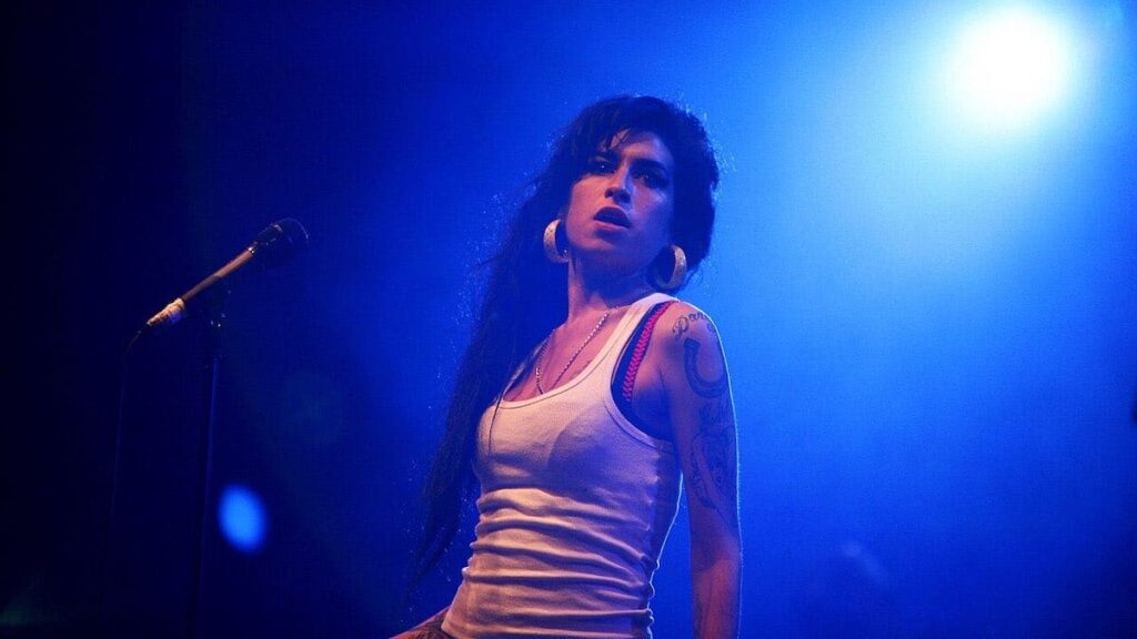 Amy Winehouse biography portrait — performing live at the Eurockéennes festival in 2007.
