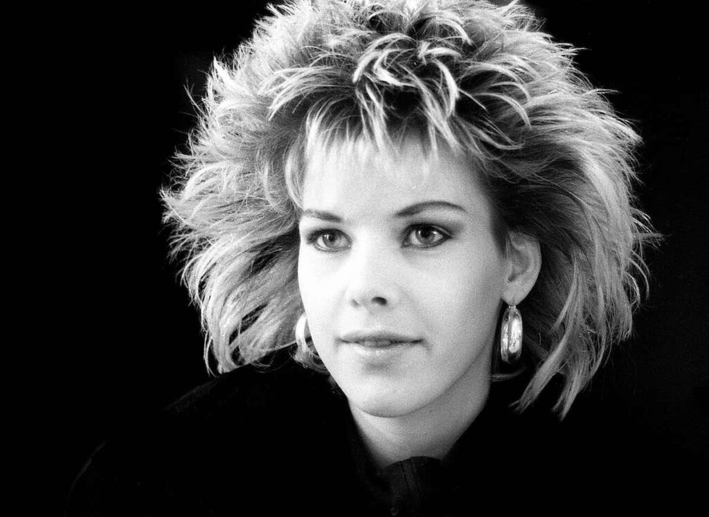C. C. Catch biography portrait — posing for a magazine photo session.
