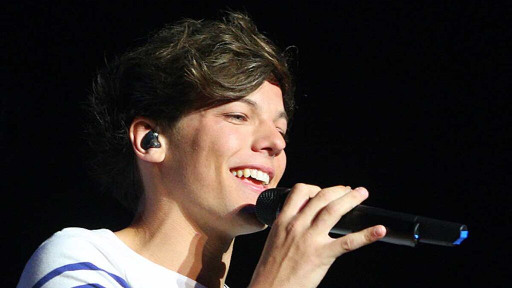 Louis Tomlinson biography portrait — young artist performing during his time with One Direction.