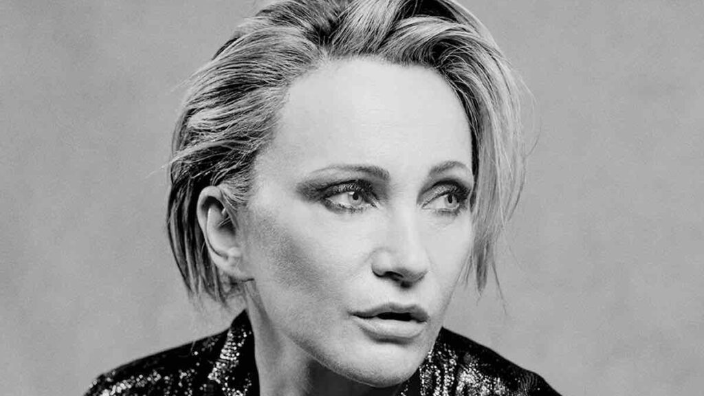 Patricia Kaas biography portrait — posing for a studio photo session.