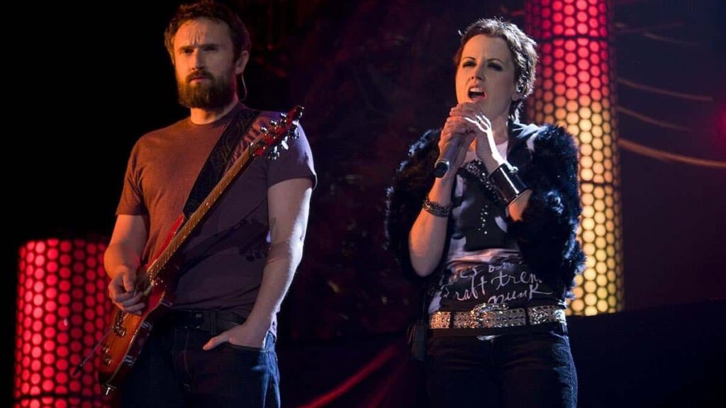 The Cranberries biography portrait — performing live on stage in Barcelona.