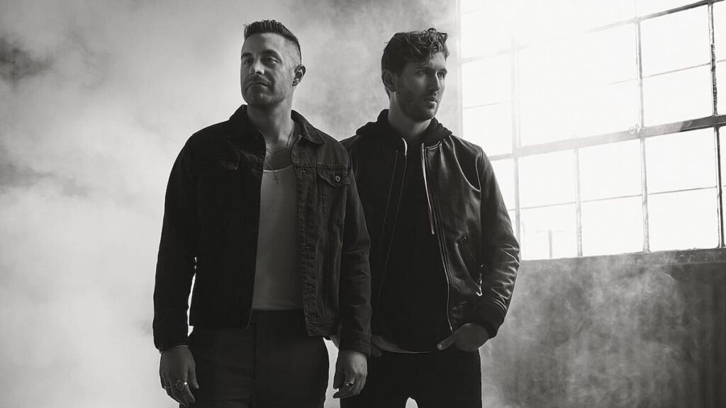 The Score biography portrait — official press photo of the band members.