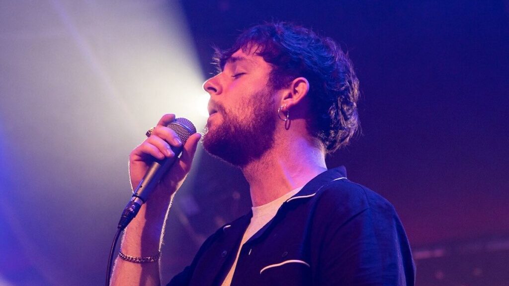Tom Grennan biography portrait — performing live on stage at Haldern Pop Festival 2017.