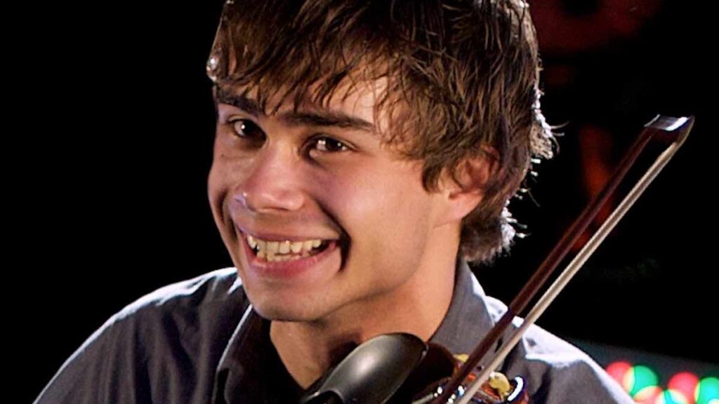 Alexander Rybak biography portrait — performing with violin on stage in Skien.