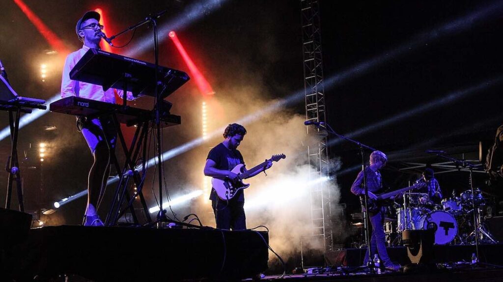 alt-J biography portrait — performing live on stage at the Melt! Festival in 2013.