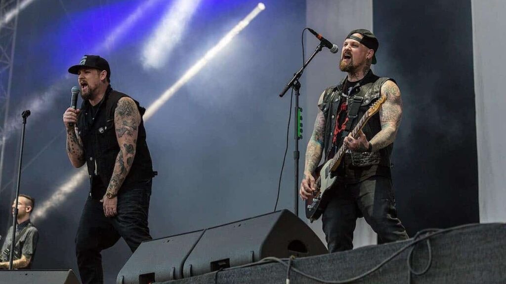 Good Charlotte biography portrait — Joel Madden and Benji Madden performing live on stage at Nova Rock 2017.