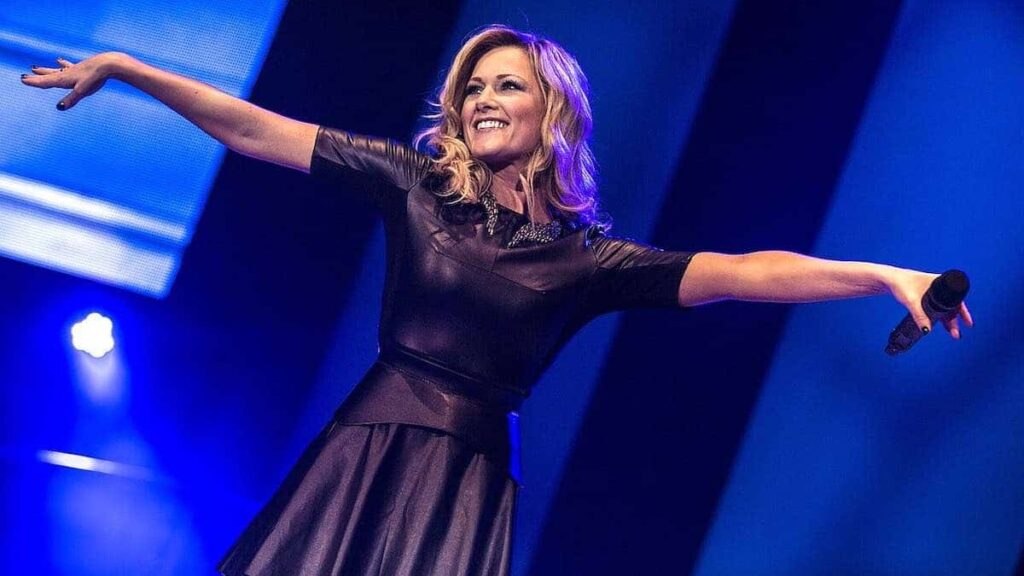 Helene Fischer biography portrait — performing live on stage during a concert in Frankfurt.