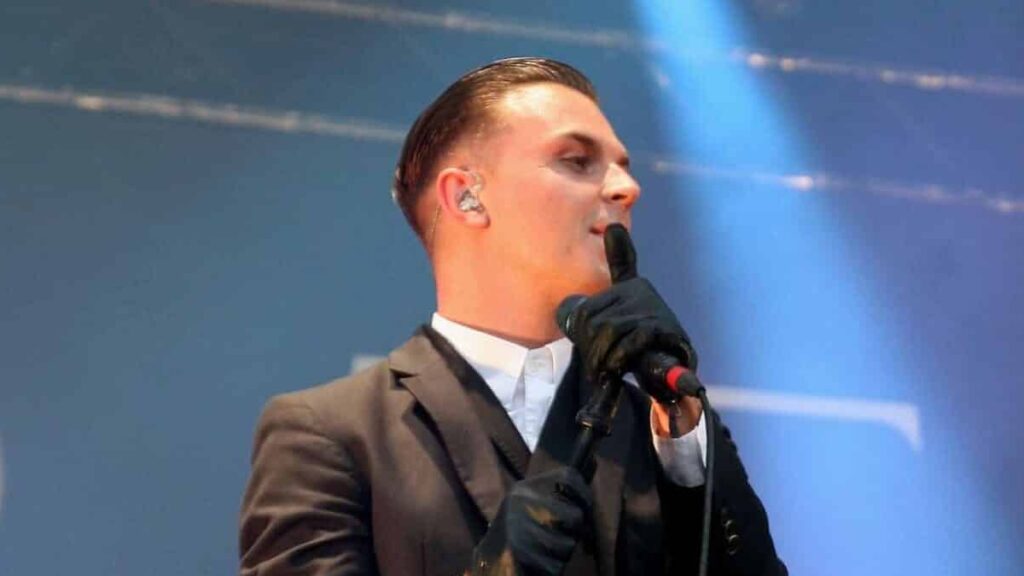 Theo Hutchcraft biography portrait — performing live with Hurts at Rock am Ring in 2013.