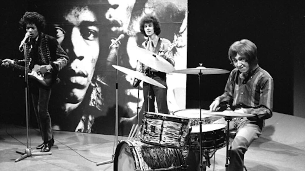 The Jimi Hendrix Experience biography portrait — Jimi Hendrix with Mitch Mitchell and Noel Redding during a television appearance.