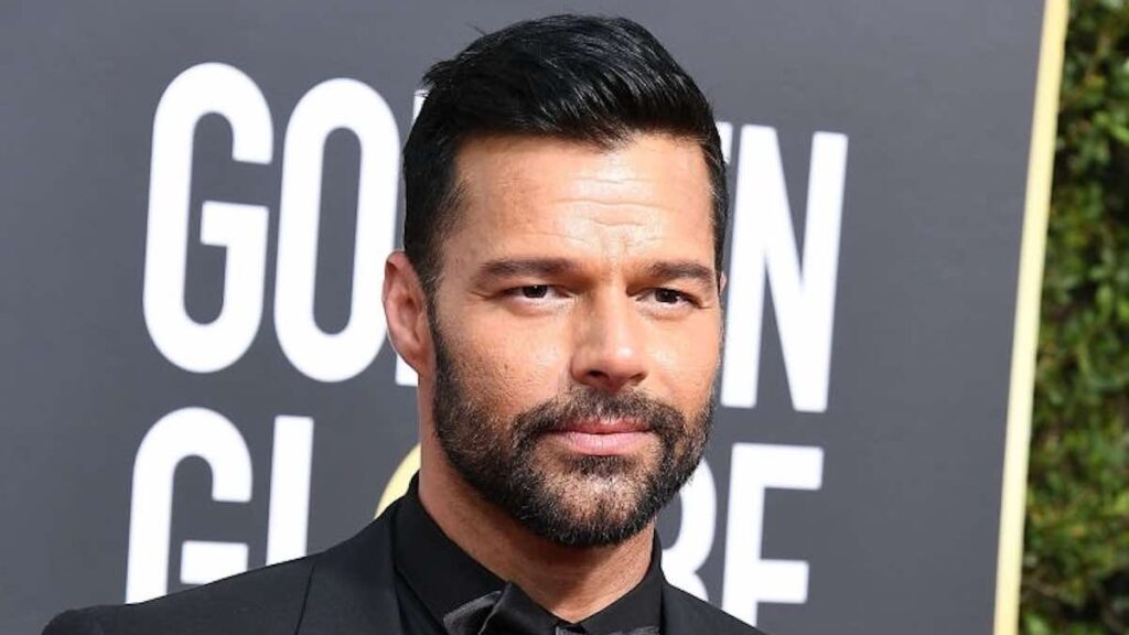 Ricky Martin biography portrait — smiling gracefully on the red carpet at the Golden Globe Awards in 2018.
