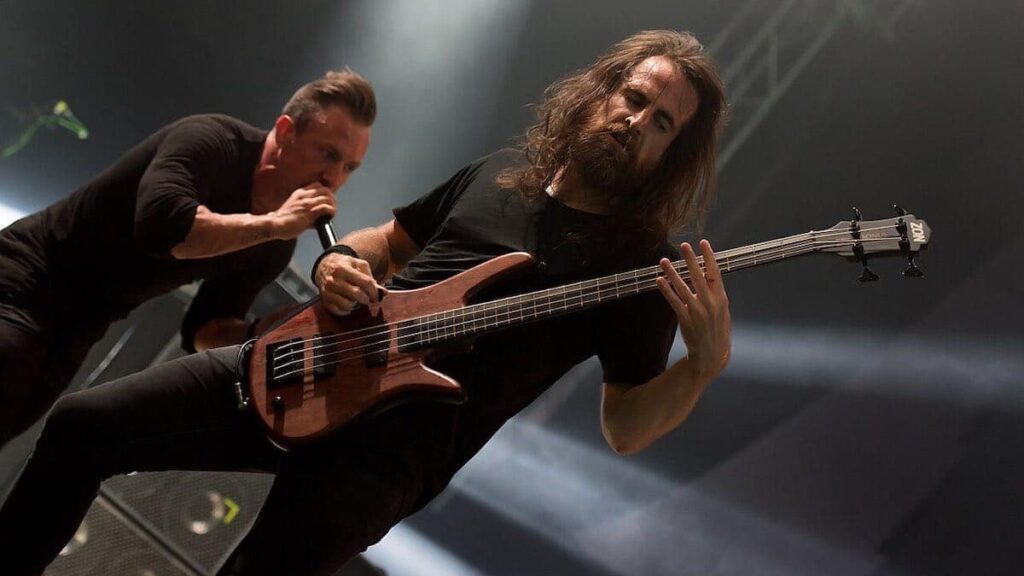 The Dillinger Escape Plan biography portrait — performing wildly on stage at the Wacken Open Air festival in 2017.